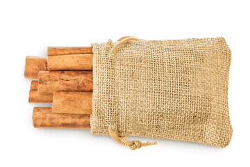 Cinnamon sticks in a bag isolated on white background. Top view. Flat lay