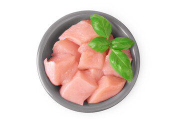 Raw diced chicken fillet in ceramic bowl isolated on white background. Top view. Flat lay