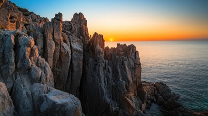 Jagged cliffs meet the fiery sunset