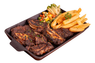 Grilled beef ribs on hot stone plate. Served with fries and vegetables. Perfect for advertising or commercial use