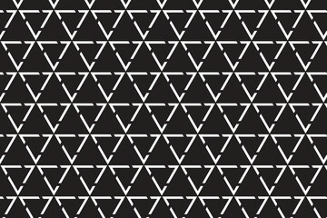 Repeating of abstract black and white triangle on dark grey background.