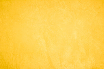 Yellow concrete stone texture for background in summer wallpaper. Cement and sand wall of tone vintage minimal. Concrete abstract wall of light yellow color, cement texture white blank for home decor.