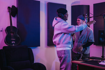 Musicians work together in a recording studio, creating music with passion and creativity. The...