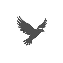 Fototapeta premium Soaring Silhouette: A striking monochrome silhouette of an eagle in mid-flight, set against a clean background, embodying freedom, power, and majestic grace.
