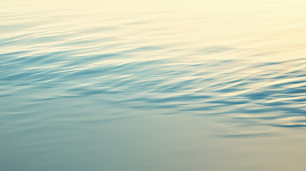 Soft waves from turquoise ocean touching smooth golden sand shoreline under calm natural morning light. Nature serenity concept
