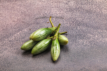 Small organic young green eggplant