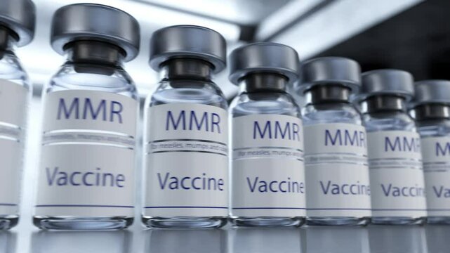 Camera movement along ampoules with MMR vaccine. Concept of medicine and healthcare. Vaccination against measles, mumps and rubella. MMR vaccine in a glass ampoule. Vials with doses of measles, mumps 