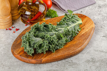 Green Kale cabbage leaves ocer board
