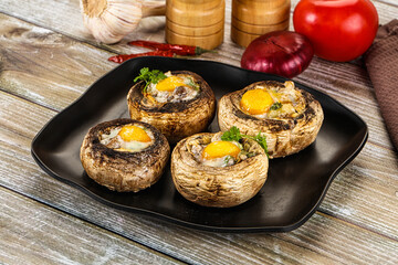 Baked champignon with quail egg