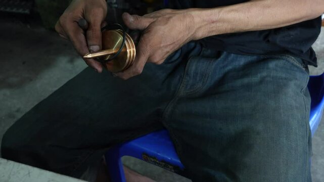4k Close-up of a craftsman using a vernier to measure the size and distance of a piece of steel.