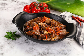 Baked chicken hearts with vegetables