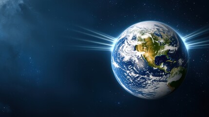 Obraz premium The planet Earth illuminated in space, with rays of light shining from behind against a dark, starry background.