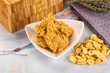 Crunchy peanut butter fat product