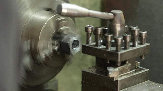 VDO 4K Lathe is working on turning metal parts for industrial use.