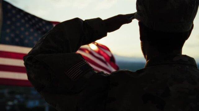 Silhouette Of A Soldier Salutes In Front Of The American Flag Memorial Day