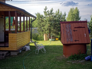 Old striped folding chairs in a rural garden