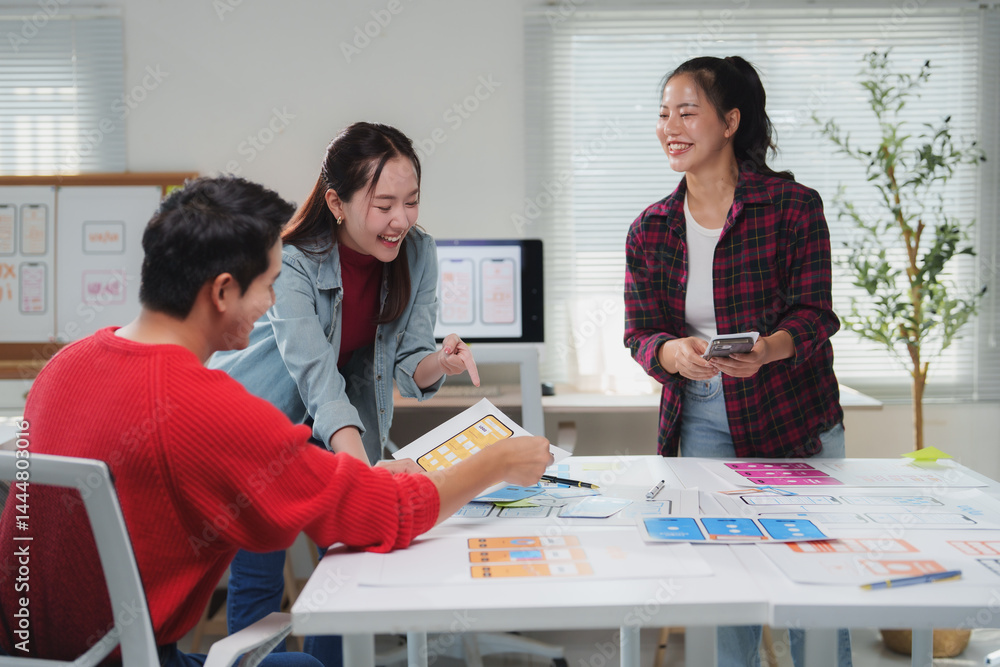 Poster diverse group of young professionals engaging in a brainstorming session for a mobile app design. th