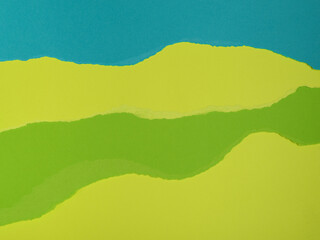 Obraz premium A vibrant abstract image featuring torn layers of teal, lime green, and chartreuse paper.