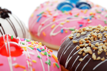 Colorful Donuts with Sprinkles and Toppings on a Bright Background