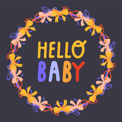A wreath of colorful bows and the inscription hello baby on a dark background in the center