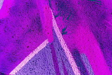 Art under ground. Beautiful street art graffiti background. The brick wall is decorated with abstract drawings house paint. Modern style urban culture of street youth. Abstract picture on wall