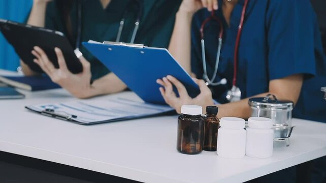 Hospital administrator conducts staff meeting