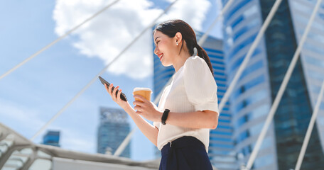 Business woman entrepreneur using smartphone financial growth with technology smart control voice...