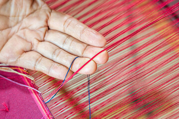Close-up of cotton weaving characteristic of Thai textiles.