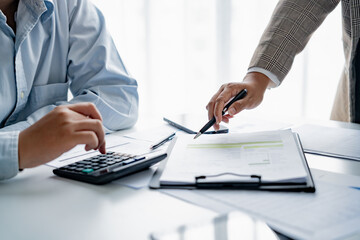 Startup business people teamwork calculating a valuation in workplace