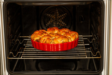 Closeup cinnamon rolls from yeast dough baked in a home oven. Shallow focus.