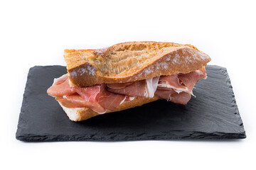 Spanish serrano ham sandwich isolated on white background. Spanish bocadillo de jamon serrano