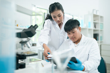 Medical science and technology professionals working in a laboratory research environment where scientists conduct chemistry tests and medical experiments to improve global healthcare