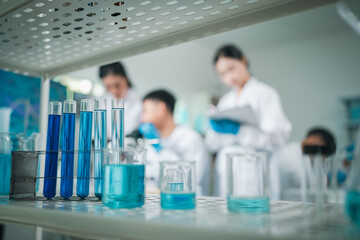 A team of scientific and medical professionals collaborate in a modern laboratory, conducting...