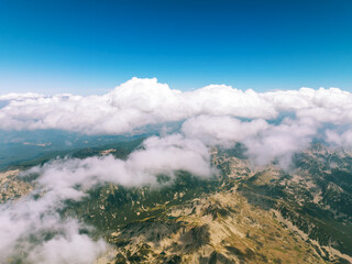 Aerial drone shot of Vihren peak in Pirin Mountains, Bulgaria. Alpine lake and jagged ridges set in...
