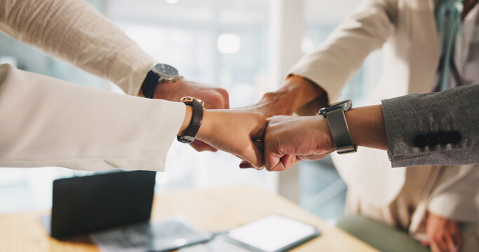 Collaboration, fist bump and hands of business people in office for motivation or solidarity. Circle, huddle and success with employee team closeup in corporate workplace for celebration or unity