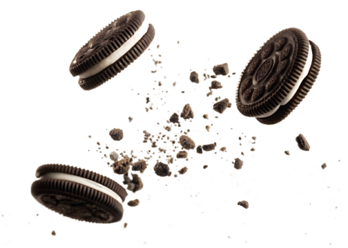 flying Oreo cookies with crumbs isolated on transparent white background, clipping path isolated on white background PNG