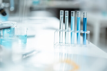 Chemical laboratory glassware with blue liquid samples in test tubes, scientific research experiment, biotechnology innovation, pharmaceutical analysis development, medical diagnostics