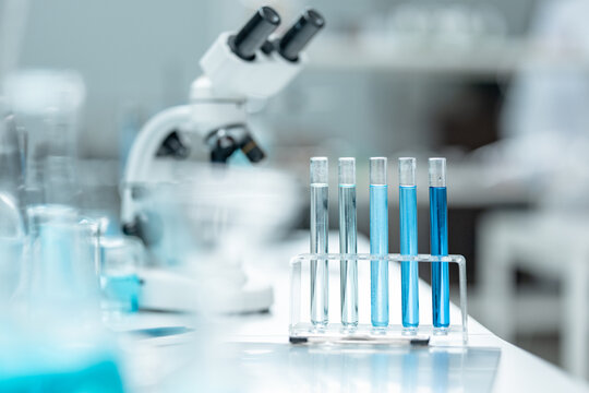 Chemical laboratory glassware with blue liquid samples in test tubes, scientific research experiment, biotechnology innovation, pharmaceutical analysis development, medical diagnostics