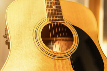 close-up of an expensive-looking acoustic guitar	
