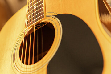 close-up of an expensive-looking acoustic guitar	
