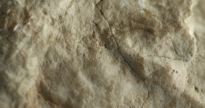 Close-up shot of cracked sandstone surface with natural earthy tones