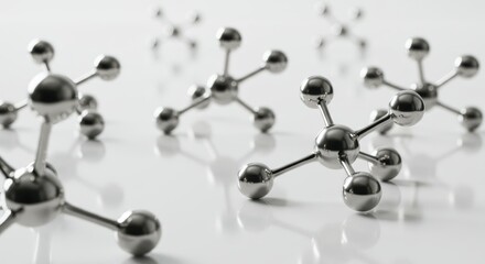 Silver ball and stick structures on white surface