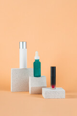 Plastic white tube for cream or lotion. Skin care or sunscreen cosmetic with stylish props on cream background.