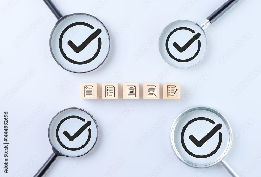 Poster quality assurance and standard certification concept. wooden blocks with document review and checkli