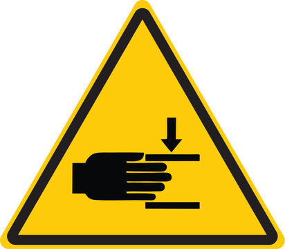 triangular warning sign featuring hand trapped under downward force with arrow symbol indicating caution