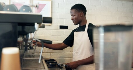 Barista, machine and man with grind preparation in cafe for latte order, premium caffeine and...