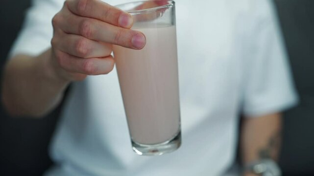 Medicinal drink in a glass.
Antiviral powder diluted in water.
Proportion of water and medicine.
Close-up of a medical preparation in a glass