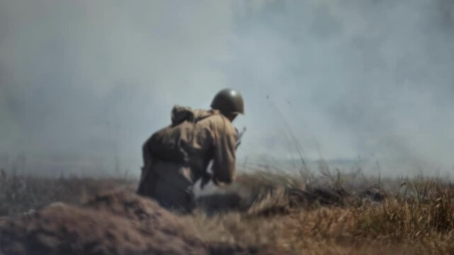 Soviet Red Army soldier loads Mosin rifle during combat battle of Great Patriotic War. Mirage heat haze smoky field. World War II reconstruction. Infantryman preparing for offensive attack. Rear back