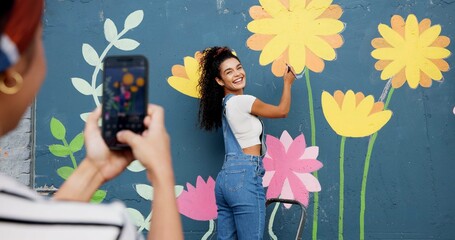 Mural, wall and picture of woman, outdoor and phone screen with art, flowers and decor for painting. Photography, painter and creative for community project, social media and people with mobile app
