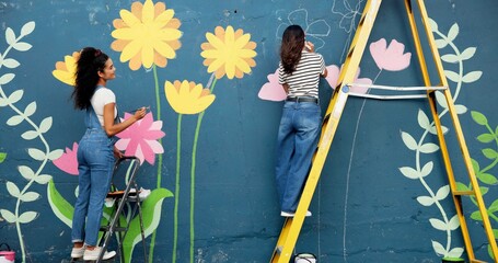 Back, women and painting mural for wall, ladder and community project with cooperation. People, outdoor and friends with creativity, expression and diy decor with flowers, student hobby and art